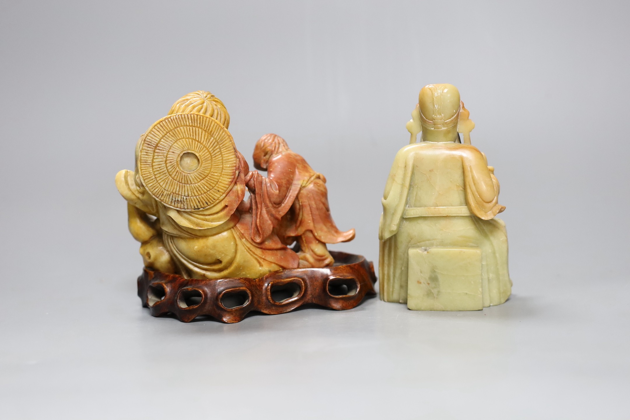 Two Chinese soapstone figures one wood stand,, widest 13 cms